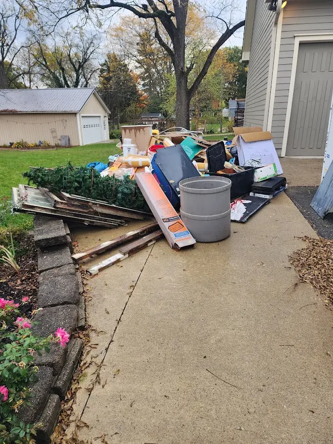 Dumpster being loaded with debris for Commercial Dumpster Rental in Jones